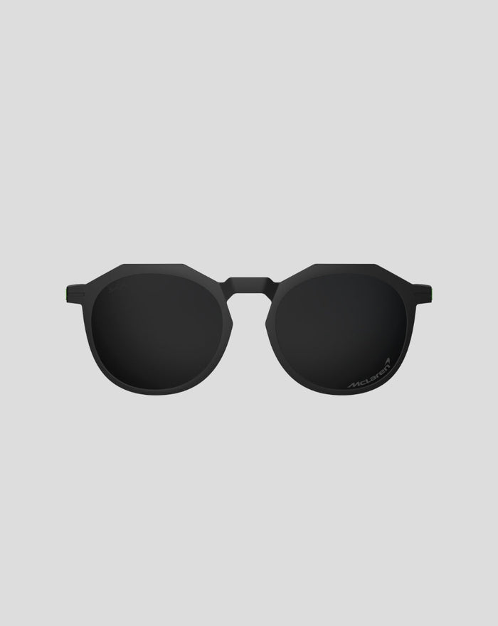 Front view of matte black Zephyrs sunglasses with rounded lenses and McLaren branding on the lens
