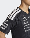 Black Mercedes AMG Petronas F1 Team men's driver T shirt with white shoulder stripes and sponsor logos on the chest.