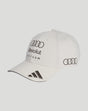 Front view of white Audi Team cap with rings logo and Revolut Team text on the front panel and dark brim accents.