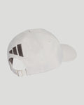 Back view of the white cap showing an adjustable strap and a three stripe graphic along the side.