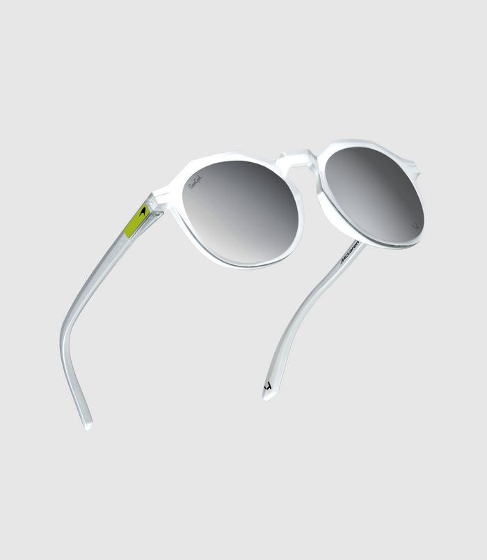 Close up of SunGod Zephyrs sunglasses frosted clear frame chrome lenses and a Lando Neon logo plate on the temple