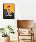 Framed McLaren Formula 1 Team poster featuring Lando Norris in race kit against an orange and black backdrop.
