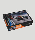 McLaren Formula 1 Team 1000 piece puzzle box showing a racing scene on the cover.