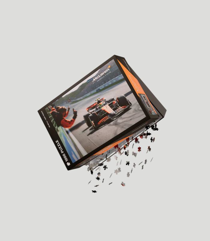 Tilted McLaren Formula 1 Team Lando Norris puzzle box on a light gray background