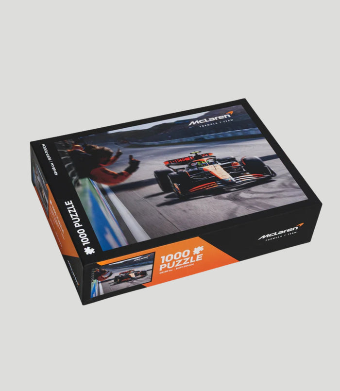 McLaren Formula 1 Team 1000 piece puzzle box showing a racing scene on the cover.