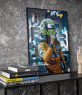 Framed Lando Norris poster displayed on a textured wall at an angle featuring a neon green helmet image.