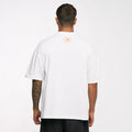 Back view of a person wearing a white Ayrton Senna oversized T shirt with a small logo on the upper back