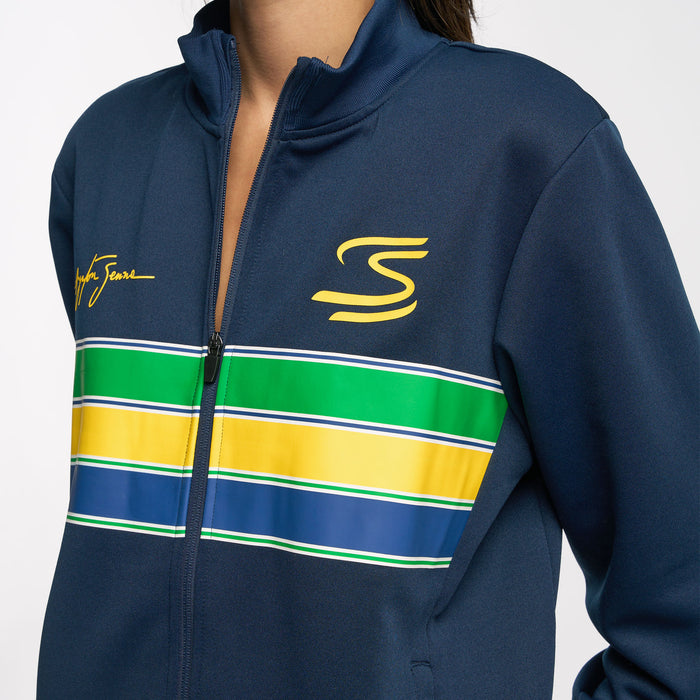 Close up of the Ayrton Senna unisex retro stripe jacket in navy showing the yellow S logo and signature on the chest with a multicolor stripe panel