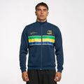 Model wearing Ayrton Senna unisex retro stripe jacket in navy with yellow S logo and signature embroidery on the chest and bold stripe panel