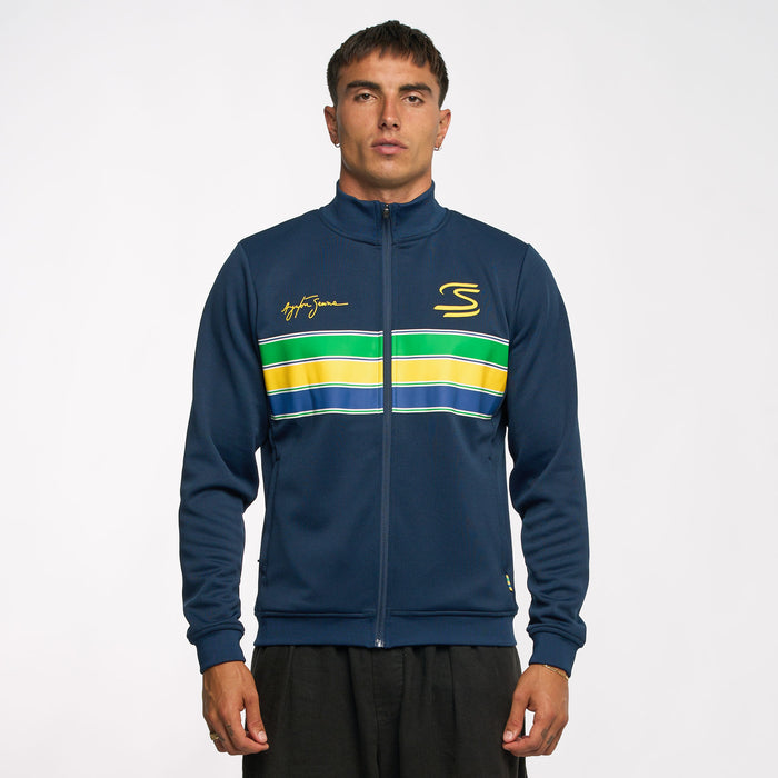 Model wearing Ayrton Senna unisex retro stripe jacket in navy with yellow S logo and signature embroidery on the chest and bold stripe panel