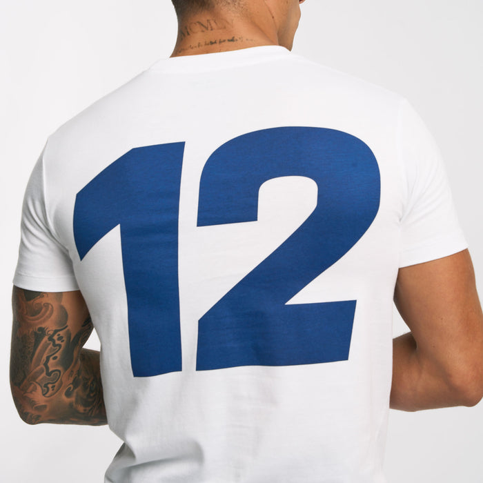 Back view close up of a white Ayrton Senna T shirt with a large blue number graphic on the back.