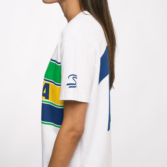 Side view of a model in a white Ayrton Senna T shirt featuring a large blue number graphic on the back.