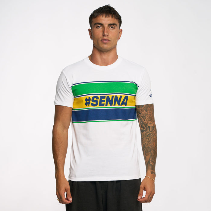 Portrait of a man wearing a white Ayrton Senna retro stripe T shirt with green navy and yellow chest stripes
