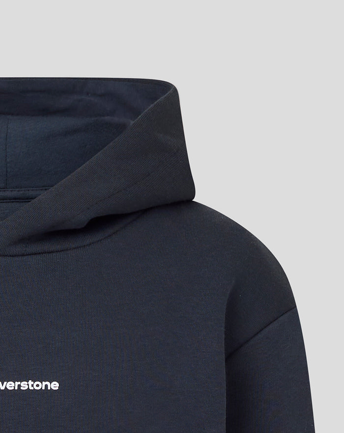 Close-up of the dark navy hooded sweatshirt highlighting the folded hood and fabric texture.