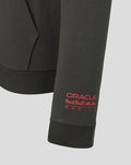 Close up of sleeve cuff on the black Oracle Red Bull Racing hoodie with red branding near the wrist