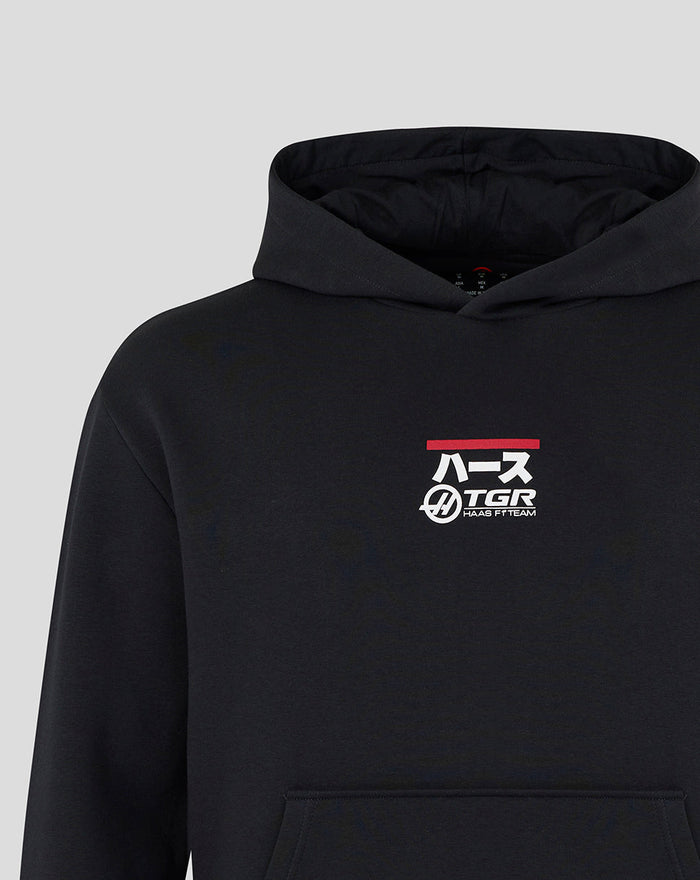 Black Haas Team unisex graphic hoodie close up showing racing car graphic and branding on left chest with red accent bar
