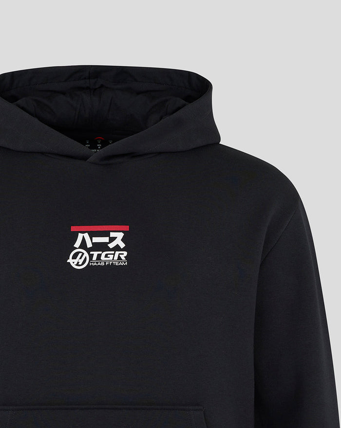 Black Haas Team hoodie close up showing racing car graphic and branding on left chest and upper back