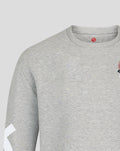 Upper front of grey marl Haas sweater showing racing car graphic on chest and a red brand mark at the neckline