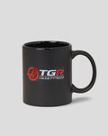 Official Haas F1 Team mug in black with red and white logos and a sturdy handle.