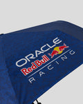 Blue branded umbrella canopy featuring Oracle Red Bull Racing logo visible.