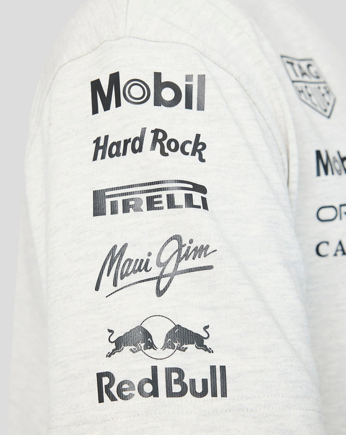 Close up of the sleeve showing Mobil Hard Rock Pirelli Maui Jim and Red Bull logos on a light heather T shirt