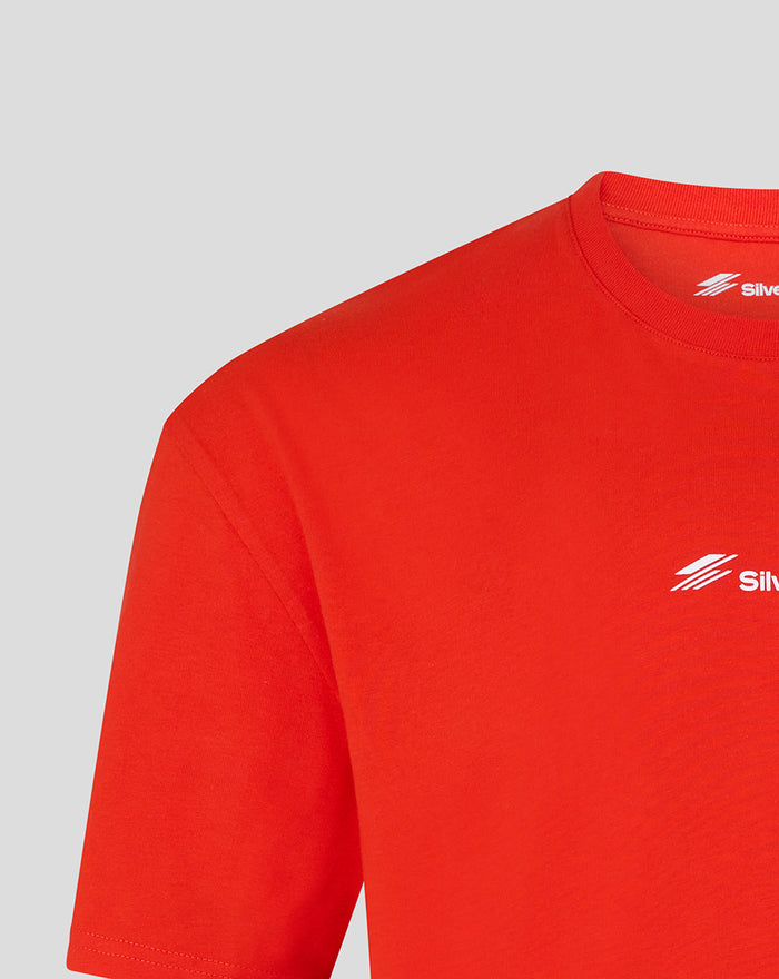 Close up of red Silverstone British Injection T shirt showing small white chest logo near the neckline