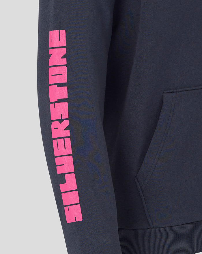 Close up of navy hoodie sleeve showing bold pink vertical lettering and partial kangaroo pocket