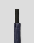 Closed Silverstone Golf Umbrella with a black handle and navy cover