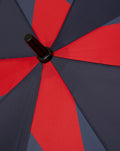 Open Silverstone umbrella with navy and red color block panels and a black hub