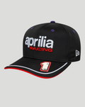 Front view of black Aprilia Racing cap with the Aprilia Racing logo on the front and racer number 1 on the left visor, purple undervisor