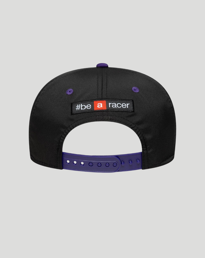 Rear view of black cap showing the be a racer patch and a purple adjustable strap.