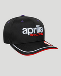 Black Aprilia Racing 9SEVENTY cap with white Aprilia Racing logo on the front and purple eyelets.