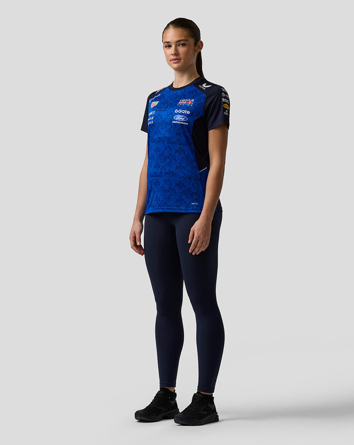 Three quarter rear view of a female model in the Oracle Red Bull Racing Womens Teamline Set Up T Shirt in Night Sky showing branding on the back