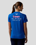 Back view of a woman wearing a royal blue BWT Alpine Formula One Team Set Up T Shirt with a large BWT Alpine logo on the back