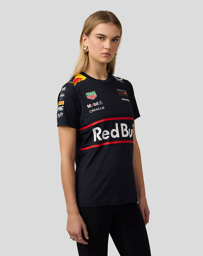 Three quarter front view of a model in a Night Sky Oracle Red Bull Racing Women’s Teamline Set Up T Shirt featuring large Red Bull branding