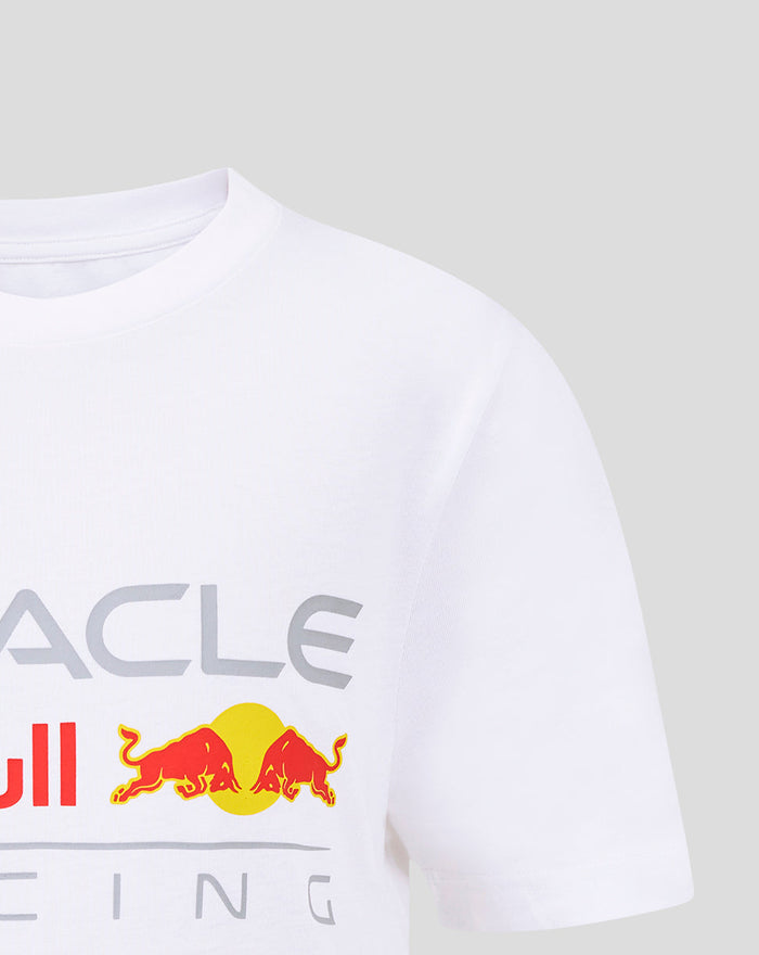 Close up of the white children's T shirt front showing the Red Bull logo with two bulls and a yellow circle