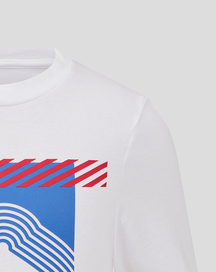 Shoulder close up of white T shirt displaying a blue graphic with white wave lines continuing from the chest.
