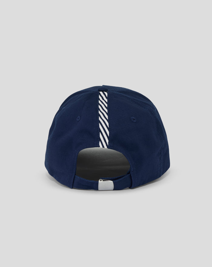 Rear view of navy Junior Silverstone Core Cap showing adjustable strap and striped inner lining through the back opening.