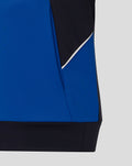 Close-up of blue teamline hoodie side panel with white piping and dark hem