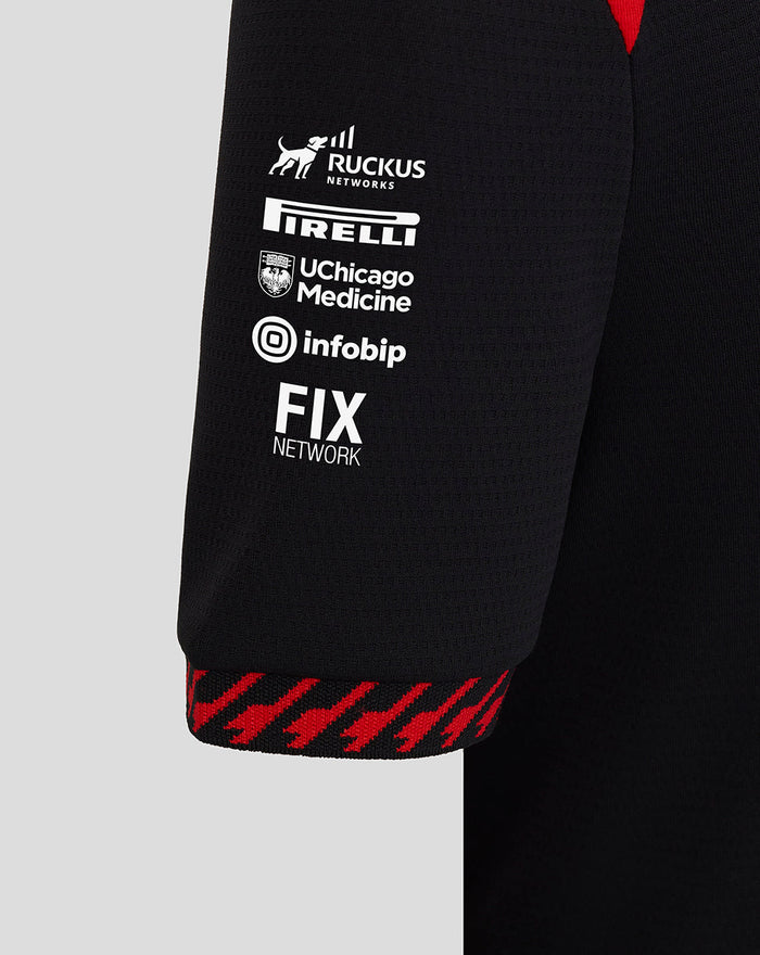 Sleeve close up with Ruckus Networks Pirelli UC Chicago Medicine Infobip and FIX Network logos and a red patterned cuff.