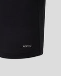 AERTEK wordmark at the front lower hem of black polo fabric