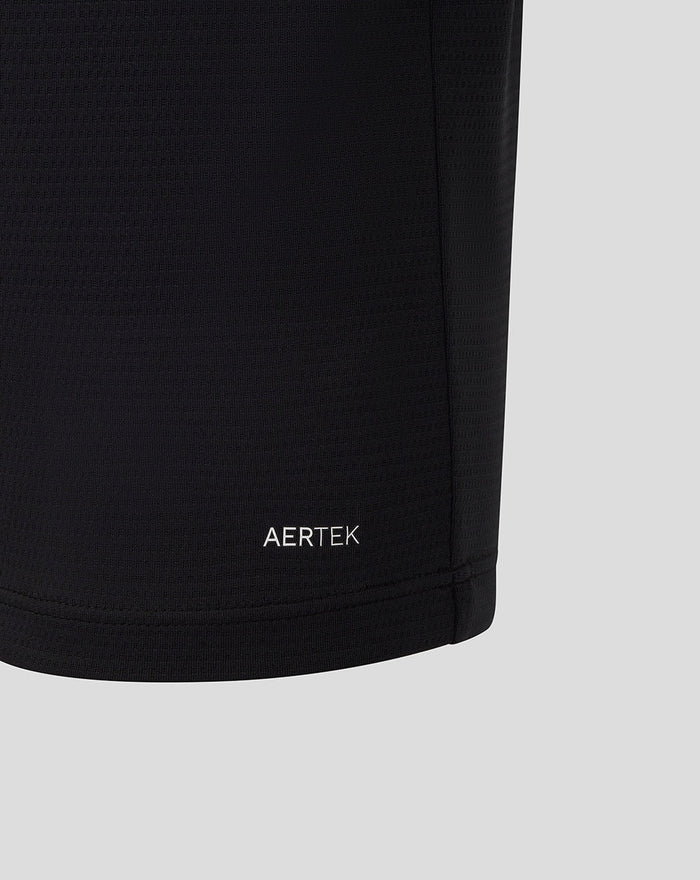 AERTEK wordmark at the front lower hem of black polo fabric