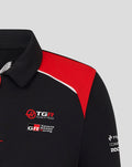 Collar and shoulder close up of black Haas polo with red panel and Haas and Toyota Gazoo Racing logos on the chest