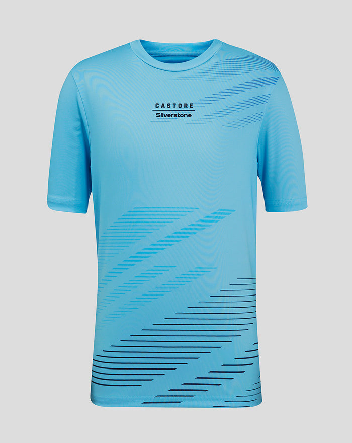 Front view of Cabana Blue Junior Silverstone x Castore sublimated T-shirt with bold diagonal graphics across the chest