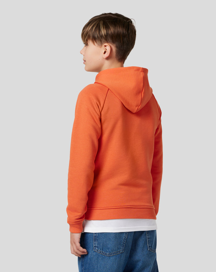 Back view of orange rust Junior Silverstone x Castore Hoodie with hood and raglan sleeves