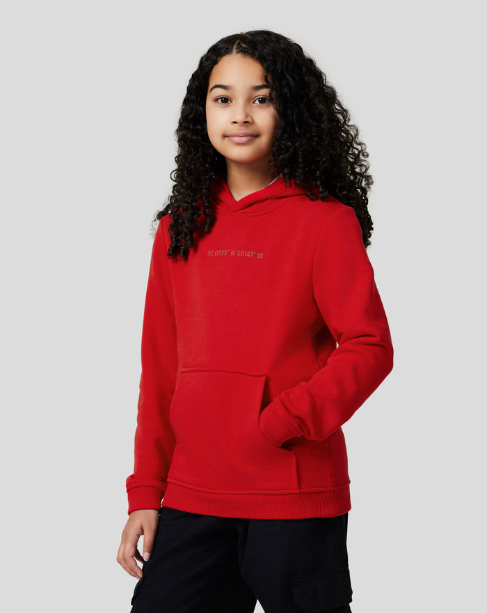 Close up of red Junior Silverstone Core Hoodie showing coordinates printed on the chest