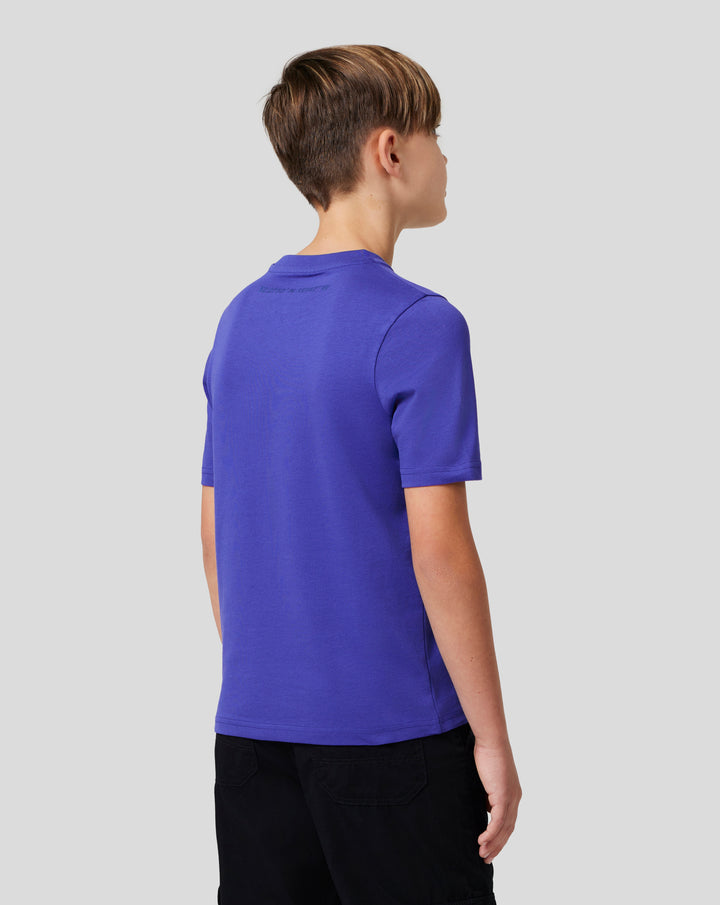 Three quarter back view of a young person in royal blue Junior Silverstone Core Graphic T-Shirt with back print