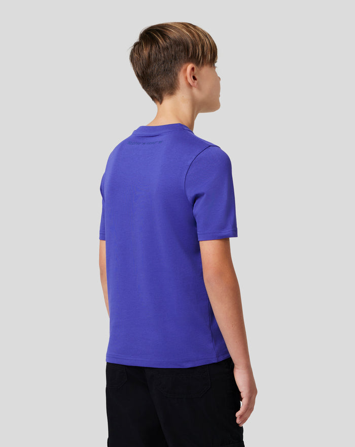 Three quarter back view of a young person in royal blue Junior Silverstone Core Graphic T-Shirt with back print
