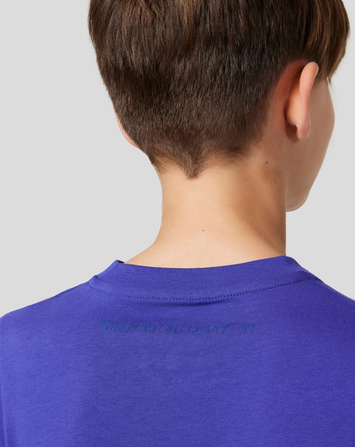 Back view of a child wearing a royal blue Junior Silverstone Core Graphic T Shirt