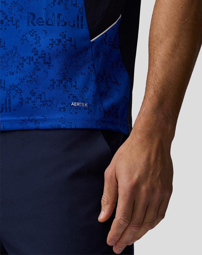 Close up of blue patterned fabric and side pocket on Oracle Red Bull Racing polo with AerTek branding at the hem